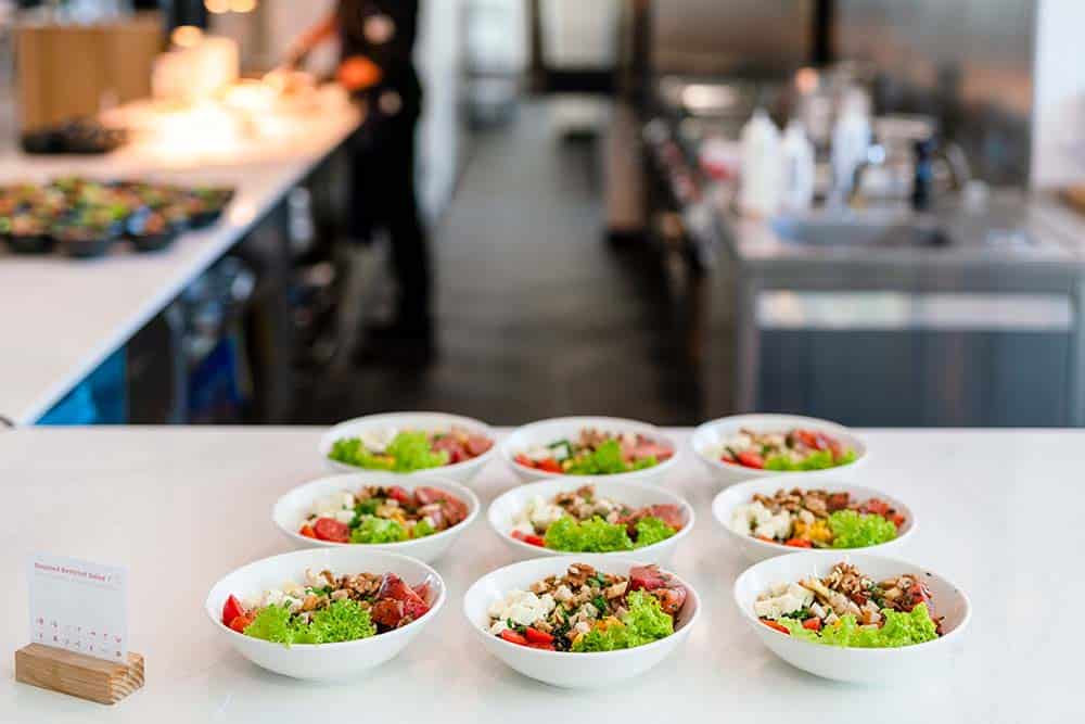 Plated Join Program meals on a counter in a company restaurant.